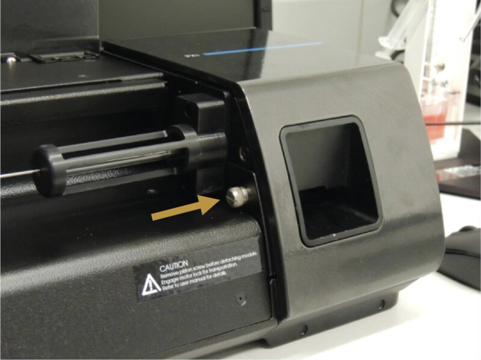 Details are in the caption following the image Location of the screw that attaches the FX module to the main chassis.