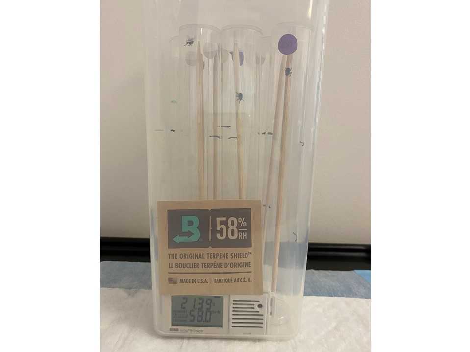 Airtight container with six tubes, humidity pack, and data logger. Example container of Dermacentor variabilis (purple) at 58% RH; every container was replicated four times for a sample size of n=24 per RH group. Airtight container with six tubes, humidity pack, and data logger. Example container of Dermacentor variabilis (purple) at 58% RH; every container was replicated four times for a sample size of n=24 per RH group.