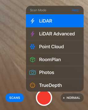3d Scanner App with the default camera interface in the background and the ‘Scan mode’ interface extended from the lower right corner. Pressing the red button will initiate a scan, the blue ‘Scans’ button will lead to a list of previous projects. The ‘Scan mode’ interface shows the different scan options. Here we focus on the default ‘LiDAR’ mode and the ‘Point Cloud’ mode. 3d Scanner App with the default camera interface in the background and the ‘Scan mode’ interface extended from the lower right corner. Pressing the red button will initiate a scan, the blue ‘Scans’ button will lead to a list of previous projects. The ‘Scan mode’ interface shows the different scan options. Here we focus on the default ‘LiDAR’ mode and the ‘Point Cloud’ mode.